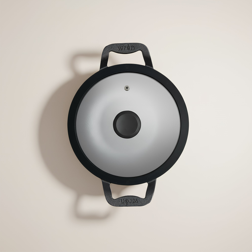 Chella cast iron wok by Wren - ergonomic handles and silicone covers